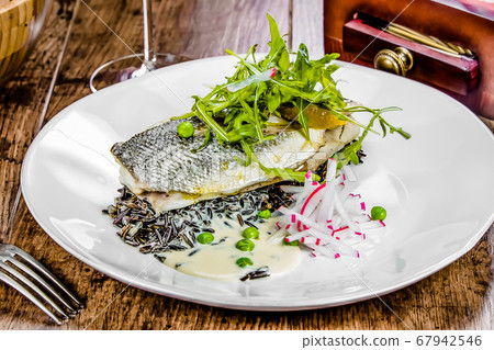 A plate of dorado on a table A plate of dorado on a table 67942546