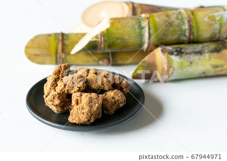Okinawa brown sugar and sugar cane Okinawa brown sugar and sugar cane 67944971