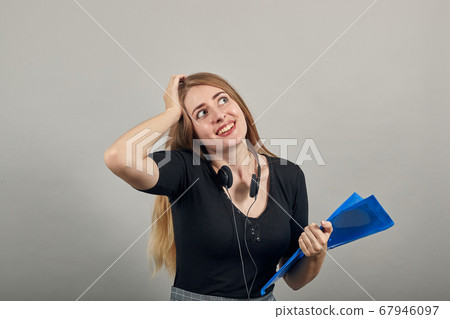 Forgetful holding hand to hair, touches head forgot something important regrets Forgetful holding hand to hair, touches head forgot something important regrets 67946097