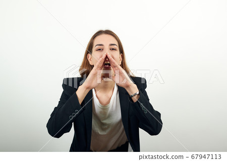 Scream and shout Holding hands near opened mouth. Screaming loudly with hand 67947113