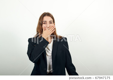 Covering mouth with palm. Can't say anything. Shocked gasping amazed hearing 67947175