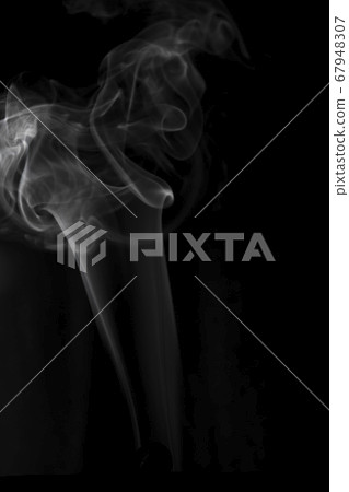 Movement of white smoke isolated on black background. 67948307
