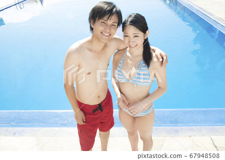 Poolside couple Poolside couple 67948508
