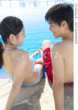 Poolside couple Poolside couple 67948512