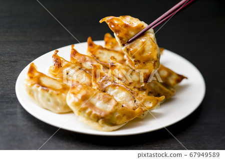 Gyoza dumplings with chopsticks Gyoza dumplings with chopsticks 67949589