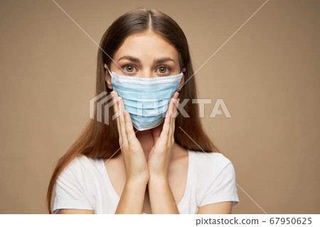 Lady in white shirt in a face mask allergy pollution 67950625