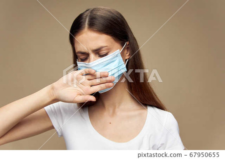 Pretty woman fashion clothes in a medical mask covid-19 epidemic Pretty woman fashion clothes in a medical mask covid-19 epidemic 67950655