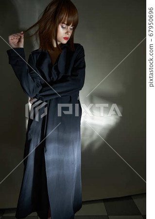Young fashion model black cloak quality photography modern style 67950696