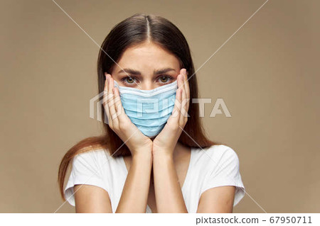 Girl stylish clothes in a face mask covid-19 epidemic Girl stylish clothes in a face mask covid-19 epidemic 67950711