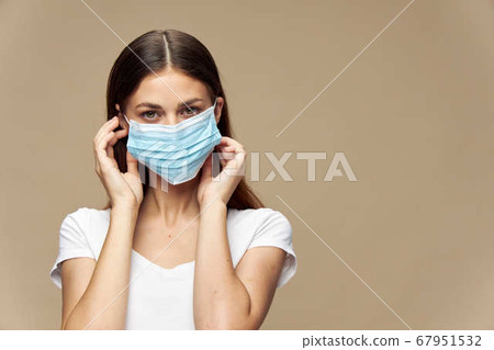 Attractive woman stylish clothes in a face mask covid-19 epidemic  67951532