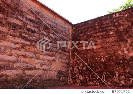 Old brick red fence 67951701