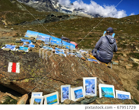 Painter drawing the mountains 67951729