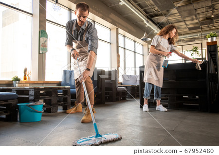 Doing cleaning in cafe Doing cleaning in cafe 67952480