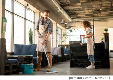 Couple preparing cafe before opening Couple preparing cafe before opening 67952481