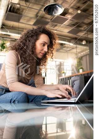 Surfing net on laptop in cafe Surfing net on laptop in cafe 67952610