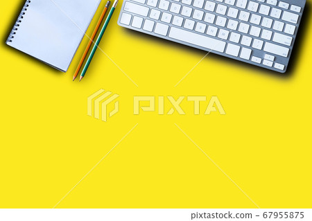 Office equipment, laptop, keyboard, pen, smartphone, notebook on a yellow background Top view from the top. Office equipment, laptop, keyboard, pen, smartphone, notebook on a yellow background Top view from the top. 67955875