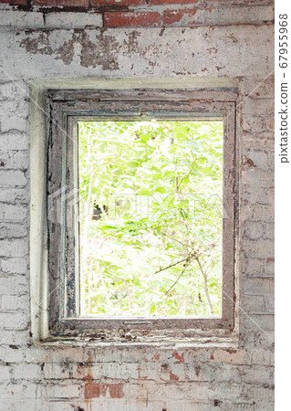 Window opening of an abandoned house without glass Window opening of an abandoned house without glass 67955968