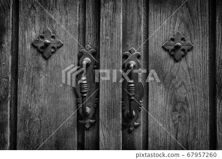 Old brown wooden door with lock 67957260