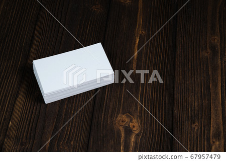 Blank business cards on wooden working table with Blank business cards on wooden working table with 67957479