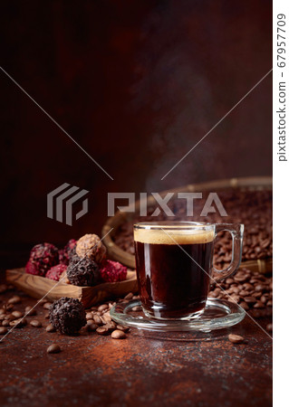 Black coffee and chocolate truffles on a old Black coffee and chocolate truffles on a old 67957709