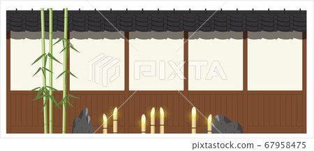 Elevated view of green bamboo and bamboo lantern on soil and board wall Elevated view of green bamboo and bamboo lantern on soil and board wall 67958475