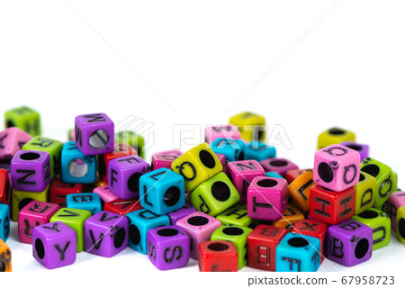 Pile of letter bead or beads with alphabet on 67958723