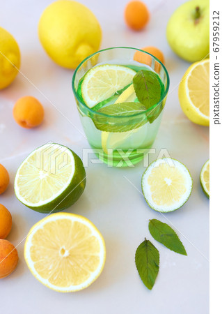 Tasty lemonade or mojito cocktail with lemon and lime. Tasty lemonade or mojito cocktail with lemon and lime. 67959212