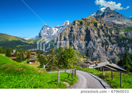 Murren mountain resort with high snowy mountains in background, Switzerland Murren mountain resort with high snowy mountains in background, Switzerland 67960033