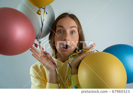 Beauty woman with colorful air balloons. Beautiful Happy Young woman on birthday holiday party. Beauty woman with colorful air balloons. Beautiful Happy Young woman on birthday holiday party. 67960323