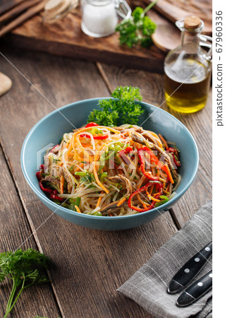 Funchoza noodle salad with stripes of vegetables Funchoza noodle salad with stripes of vegetables 67960336