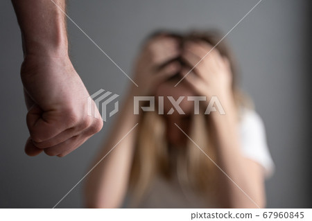Husband threatens fist wife. domestic violence 67960845