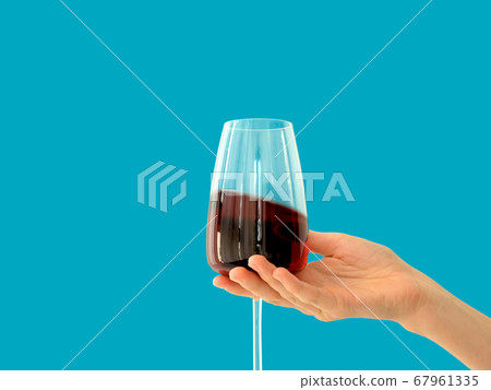 Hand with glasses of red wine 67961335
