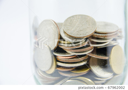 close up of thai coin in glass bottle on isolated 67962002