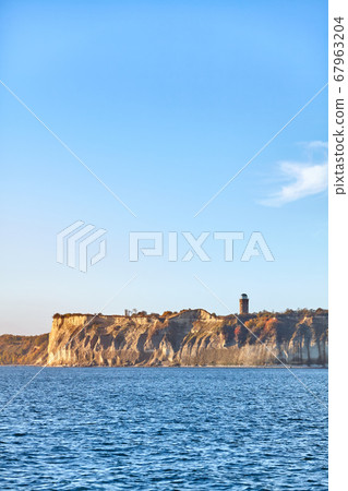 Rugen Island chalk cliffs at sunrise, Germany. Rugen Island chalk cliffs at sunrise, Germany. 67963204