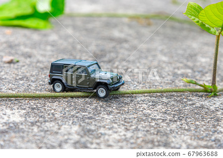 A car running on a rough road A car running on a rough road 67963688