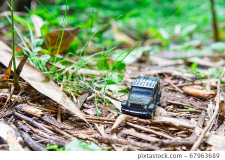 A car running on a rough road A car running on a rough road 67963689