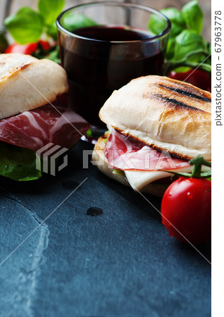 Sandwich with cheese, ham and vegetables 67963778