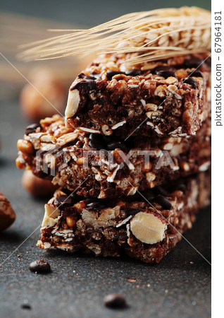 Cereal bar with nuts and chocolate Cereal bar with nuts and chocolate 67964181