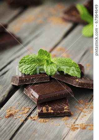 Dark chocolate with mint on the vintage table Dark chocolate with mint on the vintage table 67964649