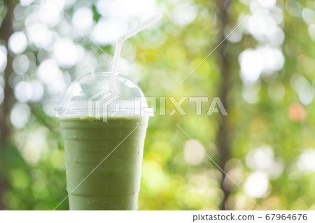 Close up glass of ice matcha green tea on wood 67964676