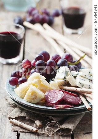 Antipasto with cheese, sausage and grape Antipasto with cheese, sausage and grape 67964941