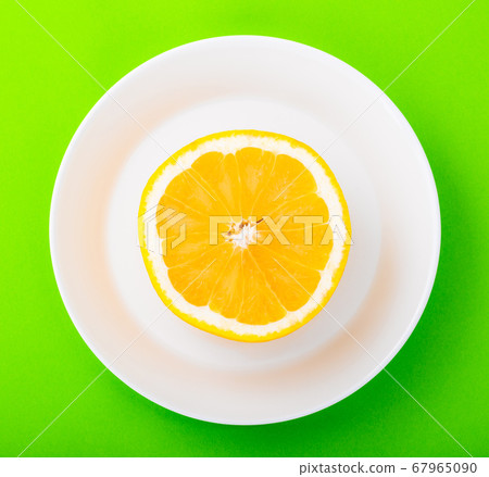 Grapefruit on a white plate 67965090