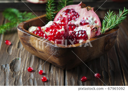 Sweet fresh pomegranate on the vintage table 67965092