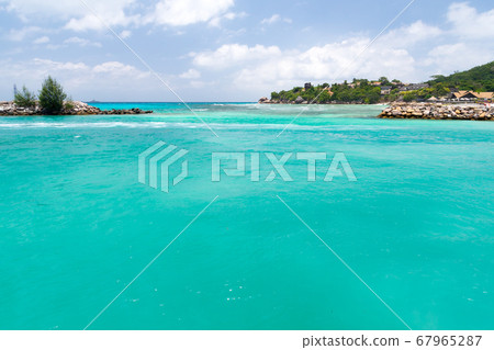Water with some rocks and small islands Water with some rocks and small islands 67965287