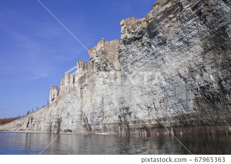 The rocky shores of the Siberian taiga river The rocky shores of the Siberian taiga river 67965363