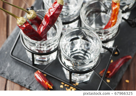 Vodka with hot chili peppers Vodka with hot chili peppers 67966325