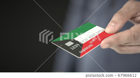 Man gives credit card with printed flag of Kuwait. Fictional numbers Man gives credit card with printed flag of Kuwait. Fictional numbers 67966612