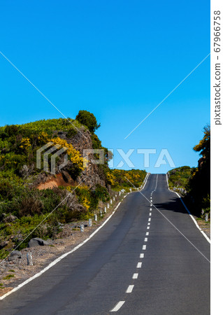 asphalt road through the green field and clouds on asphalt road through the green field and clouds on 67966758