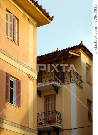 Houses in Nafplio. Nafplio is an old town in Peloponnese Greece with historic roots. Nafplio is famous for Palimidi Castle and Bourtzi Castle. Nafplio is also known as Nafplion, Nauplio and Nauplion. Houses in Nafplio. Nafplio is an old town in Peloponnese Greece with historic roots. Nafplio is famous for Palimidi Castle and Bourtzi Castle. Nafplio is also known as Nafplion, Nauplio and Nauplion. 67967935
