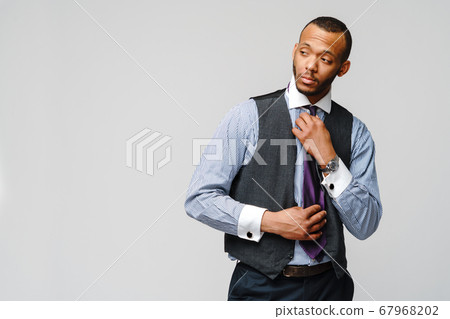 Young adult afro american businessman with tired and sick expression studio shot 67968202